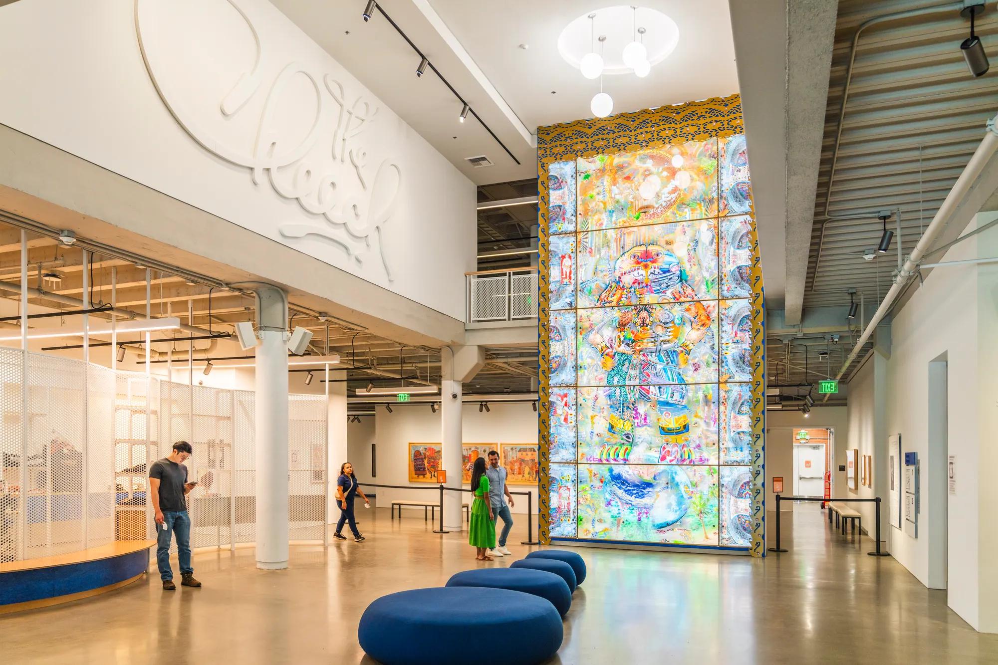A ceiling high backlit artwork illuminates the grand lobby of 'The Cheech' The Cheech Marin Center for Chicano Art & Culture.