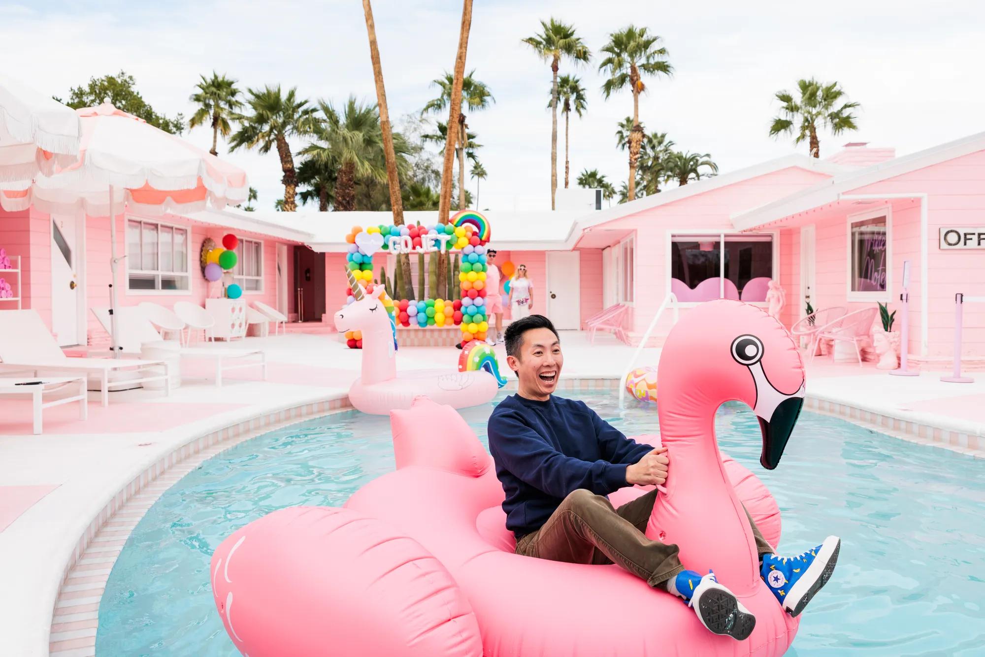 Pink flamingo and poolside lounge at the Trixie Motel in Palm Springs.