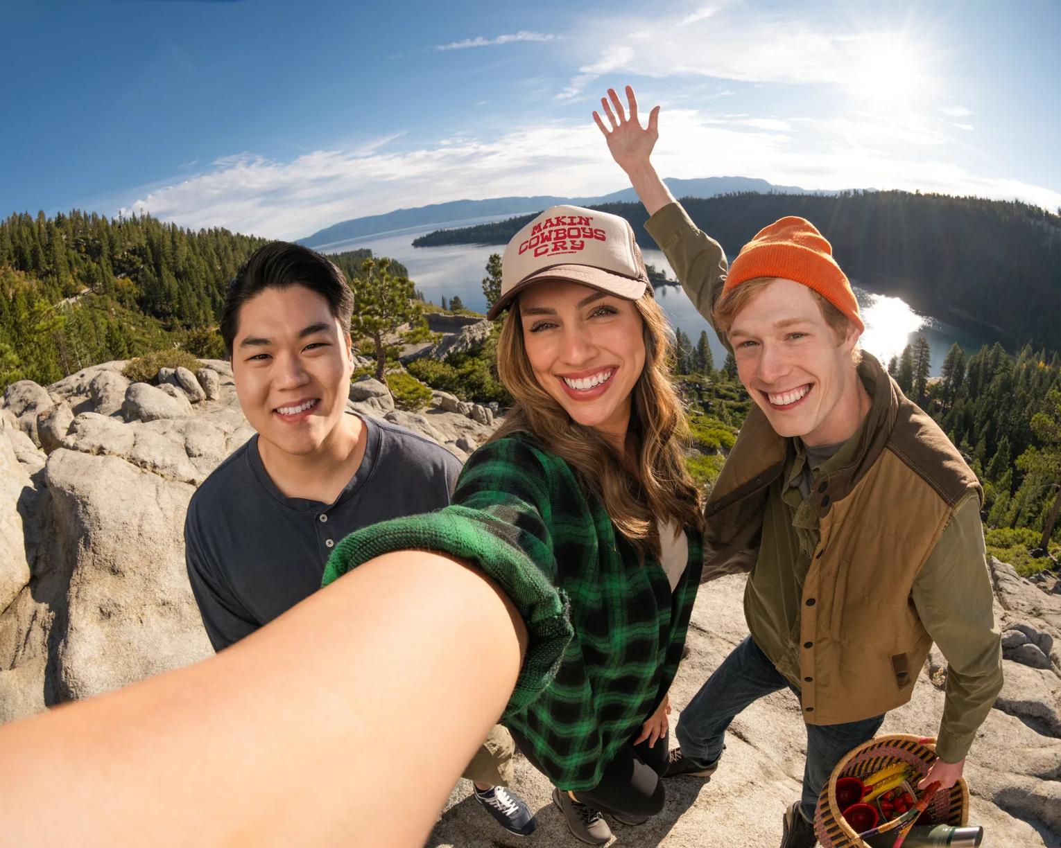 Friends take a selfie on the rocks above Emerald Bay. Shot was taken as part of the 2024 Road Trips Up Around the Bend/Playful Journeys Brand campaign shoot.