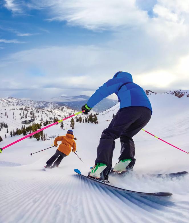 Part of the VCA "Let's Play"/"Snow" March 2024 shoot. Shot at Palisades Lake Tahoe in Lake Tahoe, CA by Corey Rich/Brand New Pictures and The Shipyard.
Two skiers shred the slopes. The photo is taken from behind the skiers, and a big puff of snow flies into the air behind them.