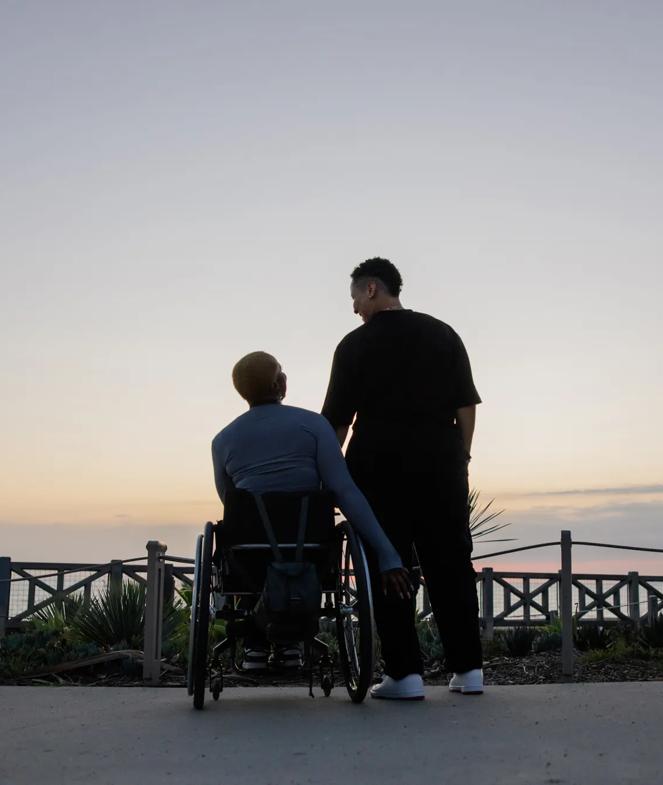 Two Friends by the Sunset, Embracing On a Wheelchair by the Path
Two individuals share a serene moment at sunset by a pathway near the ocean, highlighting friendship, inclusivity, and the beauty of nature. A wheelchair emphasizes themes of companionship and accessibility.

Image #6726091