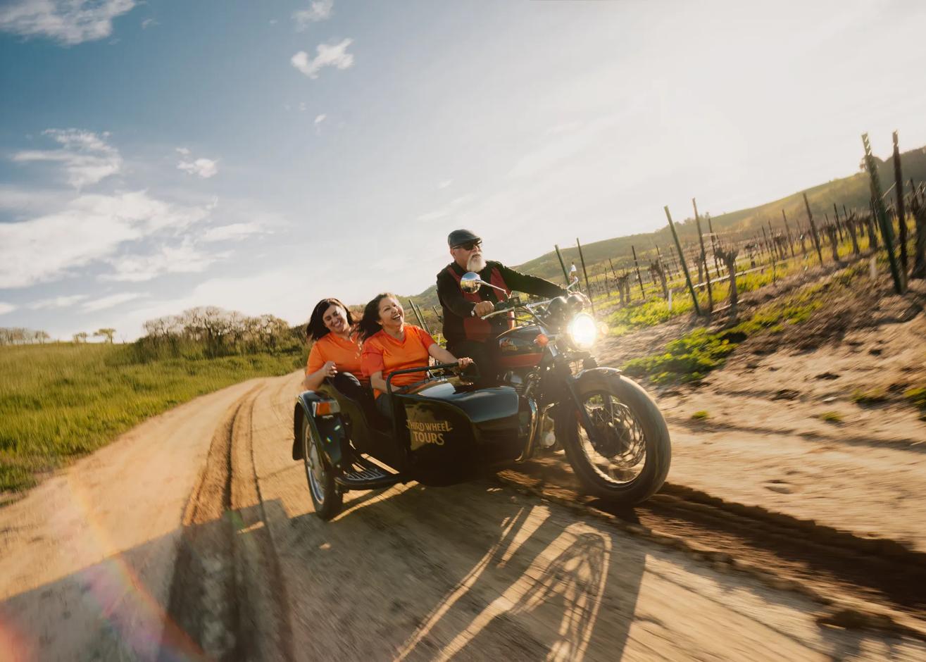 Not available for use until after May 4.

Talent rides a Third Wheel Tours sidecar at Cass Winery.

Asset captured as part of the "Extra Time" content series. Global usage in perpetuity,.